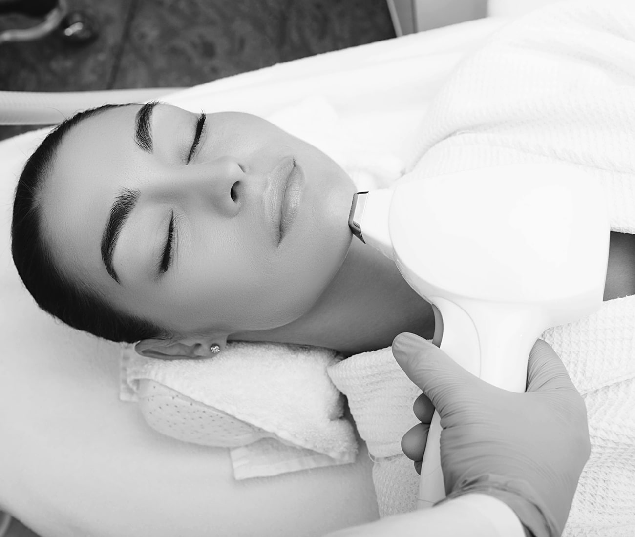 A Patient Receiving Laser Hair Removal Treatment, Black And White Photo