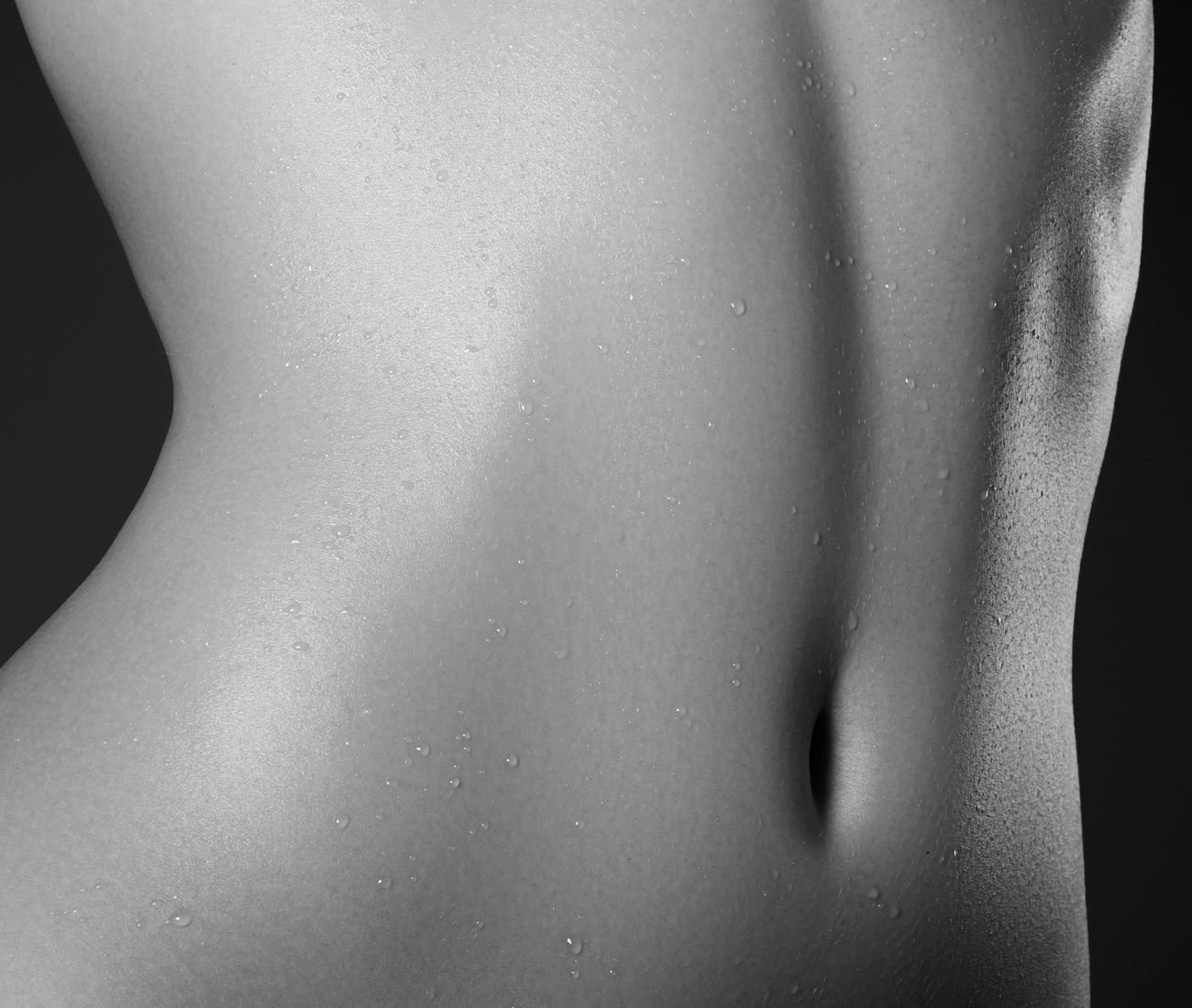 Close Up Of A Woman's Bare Stomach, Black And White Photo