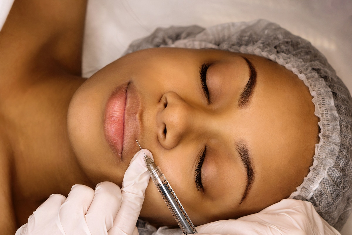 Woman Getting Botox Shot In Her Upper Lip
