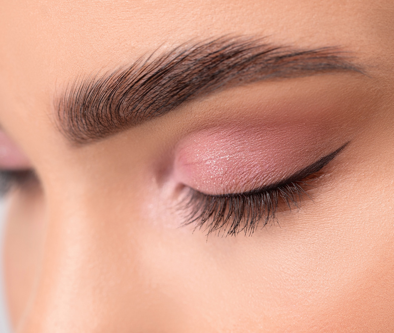 A Close Up Of Woman's Eye Makeup And Eyebrow